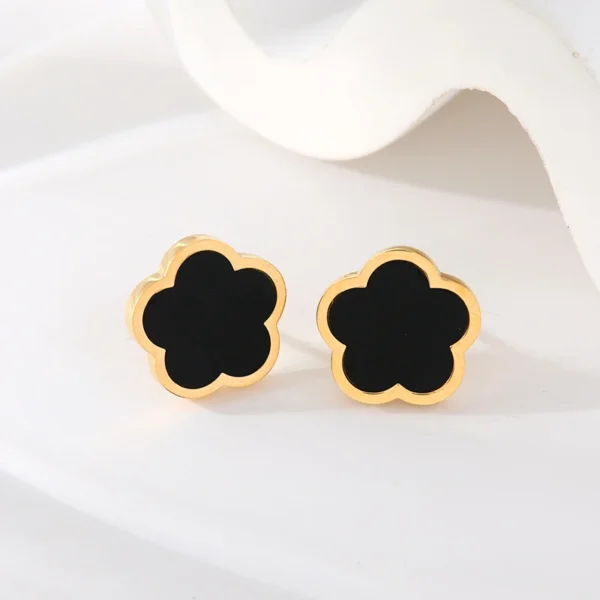 Boucles d&rsquo;oreilles trèfle dorées et noires lisses
