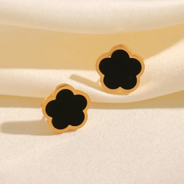 Boucles d'oreilles trèfle dorées et noires lisses