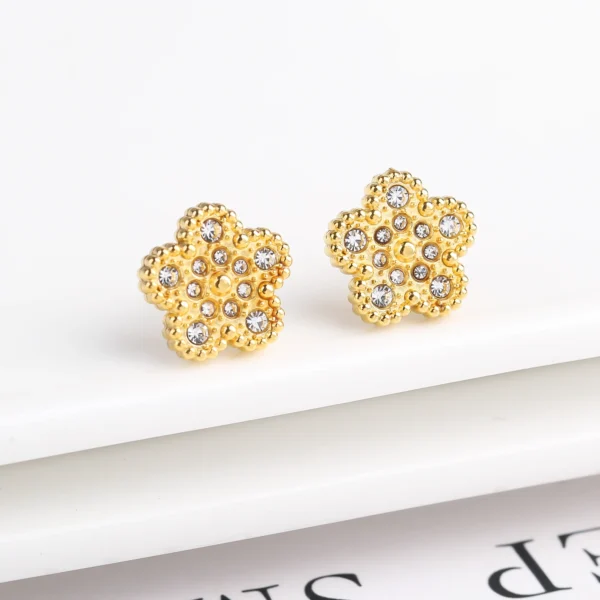 Boucles d&rsquo;oreilles trèfle or brillant avec cristaux