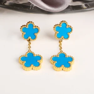 Boucles d'oreilles trèfle pendantes bleues claires et dorées