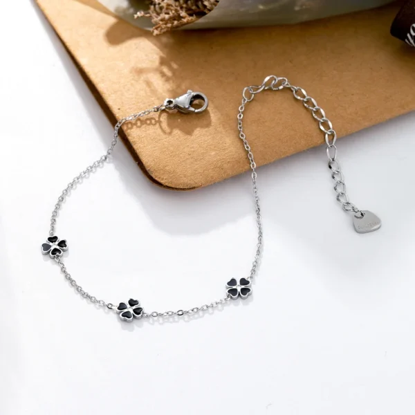 Bracelet argent avec trèfles à 4 feuilles noirs