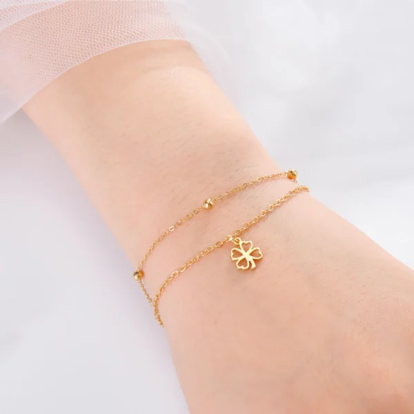 Double bracelet trèfle à 4 feuilles creux or