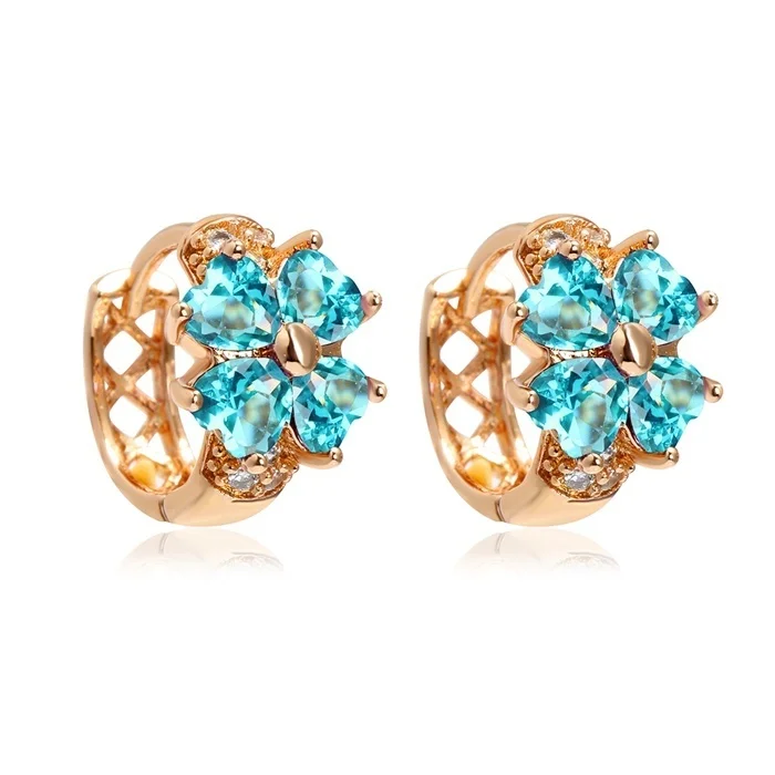 Boucles d'oreilles rondes trèfle 4 feuilles dorées avec cristaux bleus