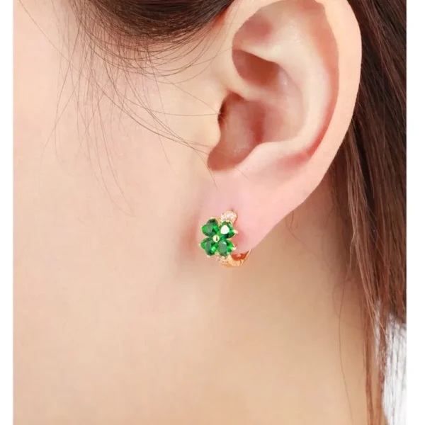 Boucles d&rsquo;oreilles trèfle 4 feuilles dorées cristaux