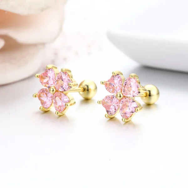 Boucles d&rsquo;oreilles trèfle dorées cristaux roses