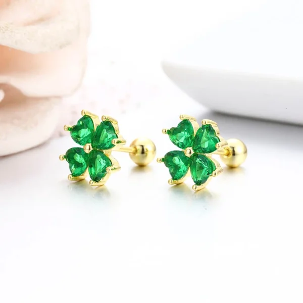 Boucles d&rsquo;oreilles trèfle dorées cristaux verts
