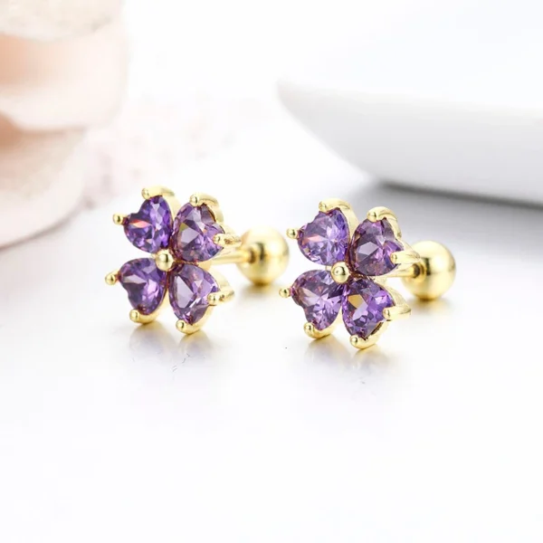 Boucles d&rsquo;oreilles trèfle dorées aux cristaux violets