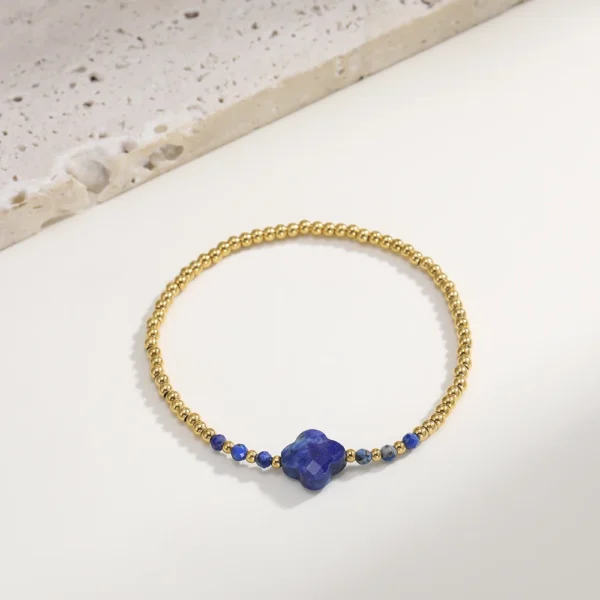 Bracelet trèfle 4 feuilles bleu foncé avec perles dorées