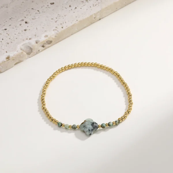 Bracelet trèfle 4 feuilles gris avec perles dorées
