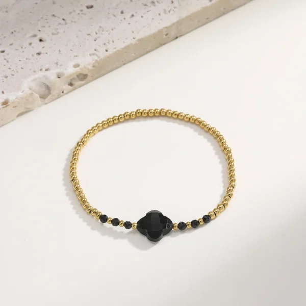 Bracelet trèfle 4 feuilles noir avec perles dorées