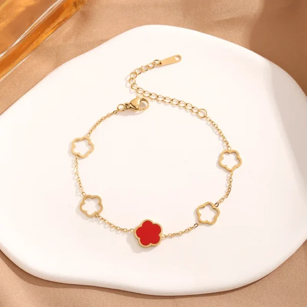 Bracelet trèfle à 5 feuilles dorés creux et rouge