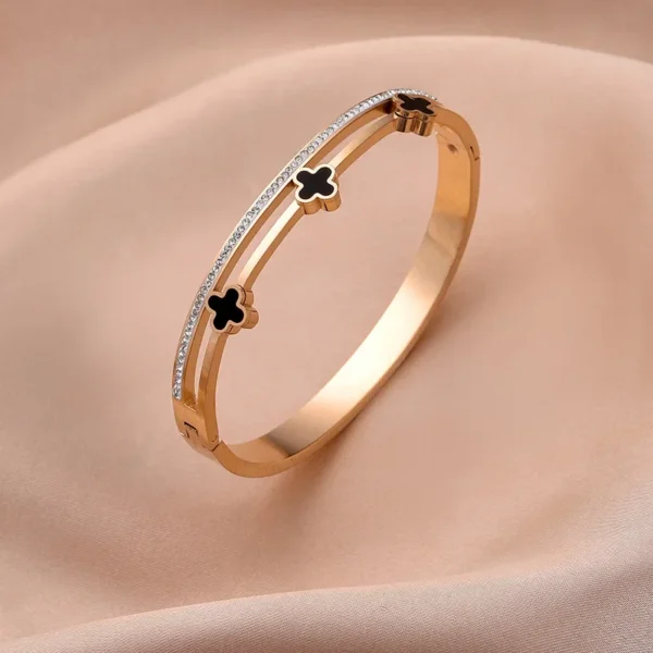 Jonc or rose avec trèfles noirs