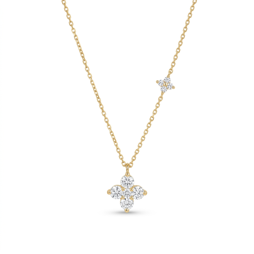 Collier en or jaune 18 carats orné d'un motif trèfle à quatre feuilles et d'un petit motif identique.